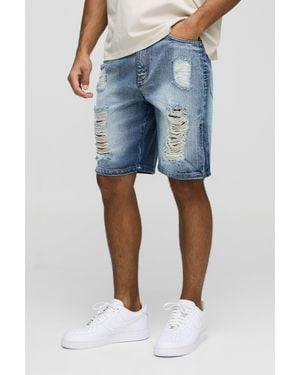BoohooMAN Relaxed Long Length Extreme Ripped Zip Denim Shorts - Blue