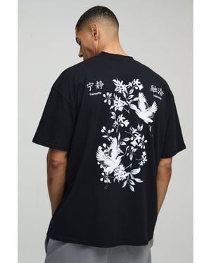 BoohooMAN Oversize T-Shirt mit floralem Print - Schwarz