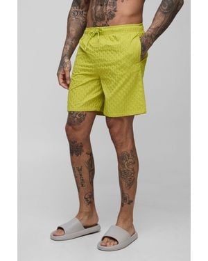 BoohooMAN Tall Textured Mid Length Swim Trunks - Yellow
