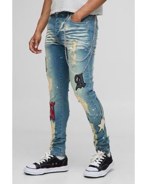 BoohooMAN Skinny Fit Stacked Pu Applique Washed Chain Jeans - Blue