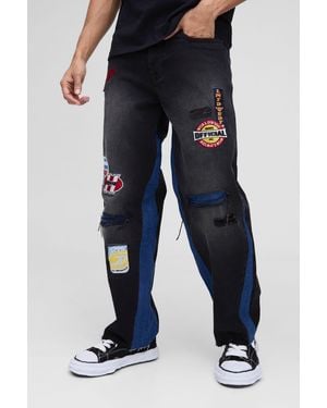 BoohooMAN Relaxed Ripped Moto Badge Gusset Jeans - Blue