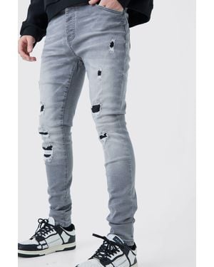 BoohooMAN Skinny Stretch Ripped Jeans In Ice Gray Wash