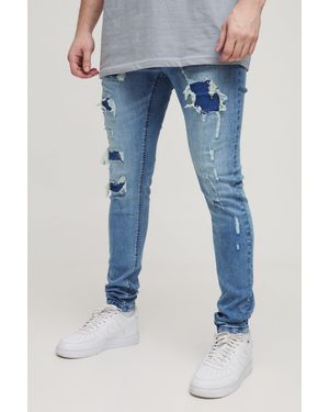 BoohooMAN Tall Super Distressed Washed Skinny Jeans - Blue