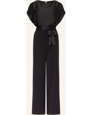 Swing Jumpsuit im Materialmix - Schwarz