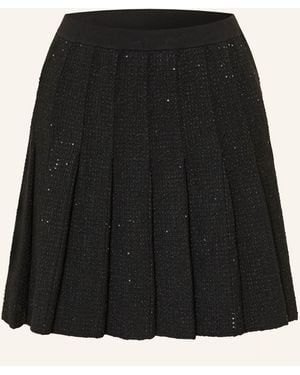 Sandro Faltenrock aus Tweed - Schwarz