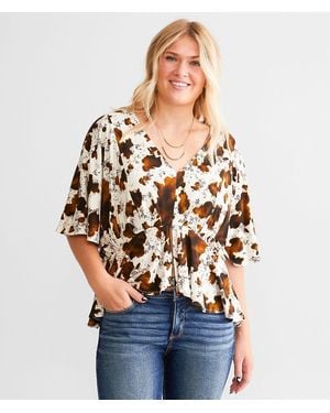 Daytrip Cow Print Split Peplum Top - White