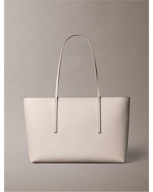 Calvin Klein Embossed Logo Zip Tote Bag - Natural