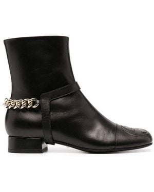 Gucci Logo Embossed Ankle Boots - Black