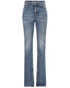 Saint Laurent Carrot-Fit Jeans With A Washed Effect in Black
