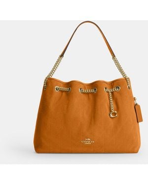 COACH Evelyn Shoulder Bag With Quilting And Charm - Brown
