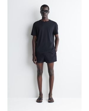 COS Gestreifte Badeshorts - Blau
