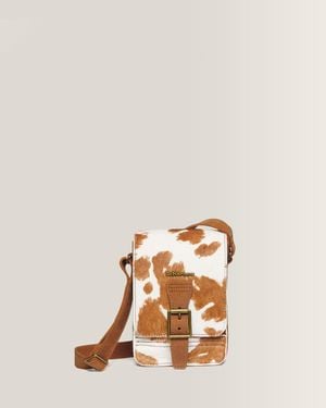 Dr. Martens Bolso bandolera vertical de hair-on con estampado de vaca en cámel - Naranja