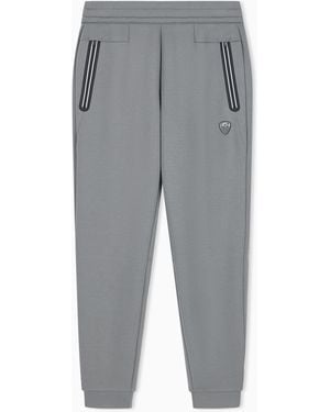 EA7 Slim-Fit Jersey Trousers Premium Shield With A Metal Logo - Grey