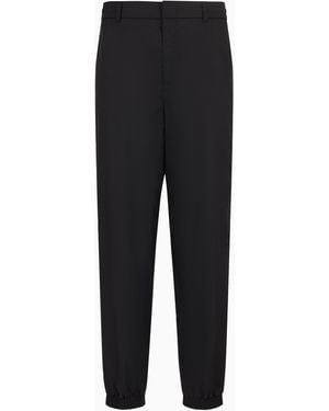 Emporio Armani Jacquard Nylon Trousers With Elastic Hems And All-Over Logo Lettering - Black