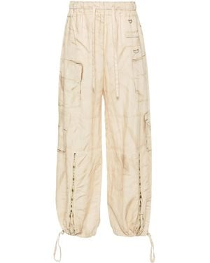 Acne Studios Pantalones anchos con estampado trompe l'oeil - Blanco