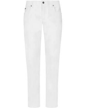Dolce & Gabbana Vaqueros slim con placa del logo - Blanco