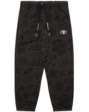Aape By A Bathing Ape Jogginghose Mit Graffiti-Print - Schwarz