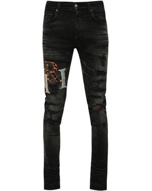 Amiri Logo-Patch Distressed Skinny Jeans - Black