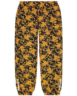 Supreme Floral-Pattern Track Trousers - Yellow