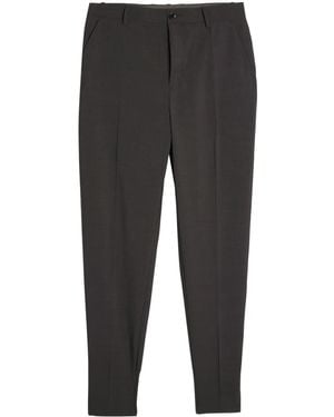 Undercover Pantalones tapered con aplique del logo - Gris