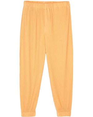 Homme Plissé Issey Miyake Plissé Tapered Trousers - Orange