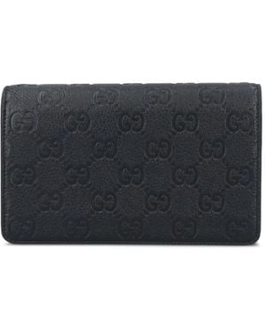 Gucci Cartera con monograma en relieve - Gris