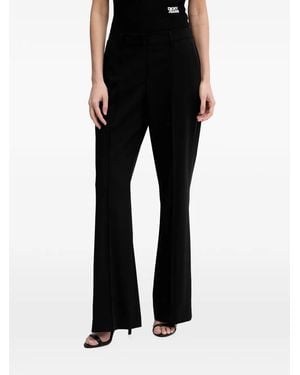 DKNY Pressed-Crease Logo-Plaque Trousers - Black