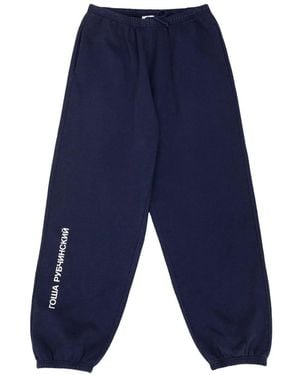 Gosha Rubchinskiy Logo-Print Cuffed Track Trousers - Blue