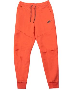 Nike ロゴプリント パンツ - オレンジ