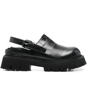 Moschino Buckle Embossed Leather Mules - Black