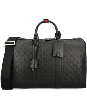 Gucci Medium Gg Emblem Embossed Holdall - Black