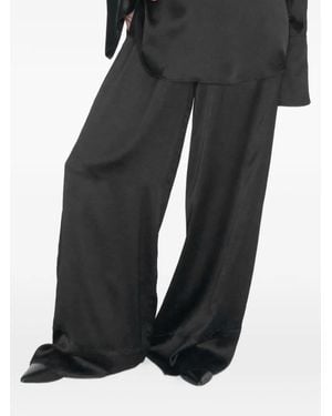 STUDIO AMELIA Pantalones Palazzo Fluid - Negro