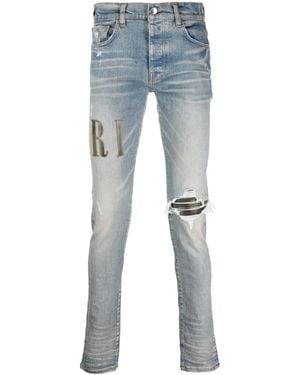 Amiri Light E Ripped Skinny Jeans With Embroidery In Cotton Man - Blue