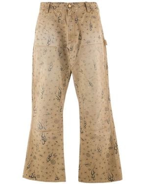 SAINT Mxxxxxx Dr. Woo Graphic-Print Trousers - Natural