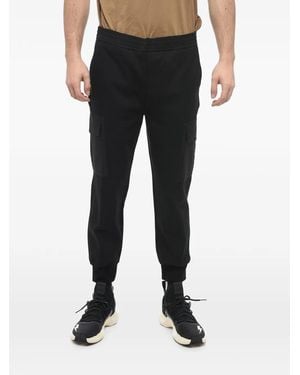 Neil Barrett Low-Rise Skinny-Fit Tapered Trousers - Black