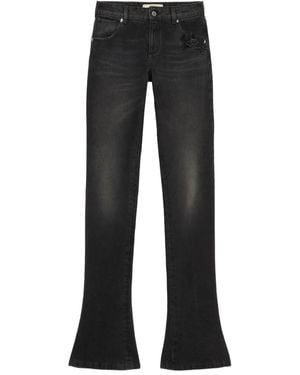 Blumarine Vaqueros acampanados con aplique de mariposa - Negro