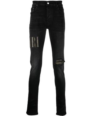 Amiri Logo-Appliqué Distressed Jeans - Black