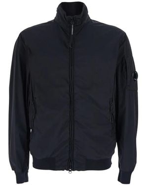 C.P. Company Nylon Turtleneck Jacket With Lens Detail On The Left Sleeve - Blue