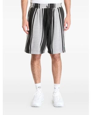 Pleasures Gestreifte Shorts - Schwarz