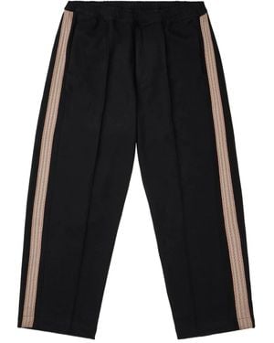 Sasquatchfabrix. Pantalones con detalle a rayas - Negro