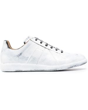 Maison Margiela Sneakers in pelle bianche con dettaglio spruzzi di vernice - Bianco