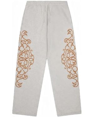 DENIM TEARS Embroidered Track Trousers - White