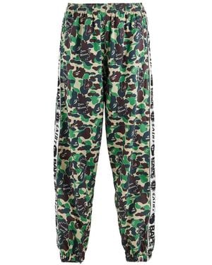 SAINT Mxxxxxx X A Bathing Ape Camouflage-Print Logo-Tape Track Trousers Trousers - Green