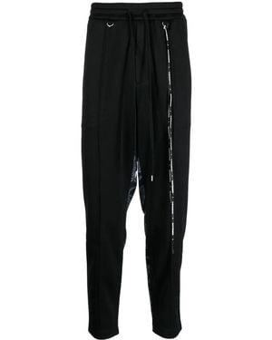 MASTERMIND WORLD Camouflage-Print Track Pants - Black