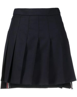 Thom Browne Minigonna plissettata blu con orlo asimmetrico