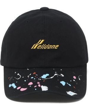 we11done Gorra con motivo de salpicadura de pintura - Negro