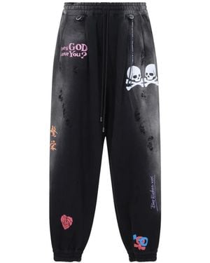 MASTERMIND WORLD Distressed Graphic-Print Track Pants - Black