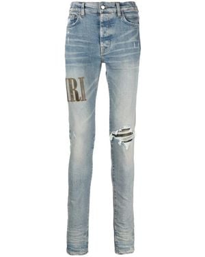Amiri Light E Ripped Skinny Jeans With Embroidery In Cotton Man - Blue
