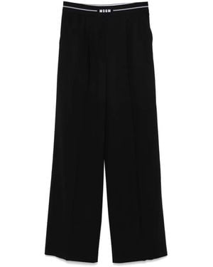MSGM Pantalones con logo en la cinturilla - Negro