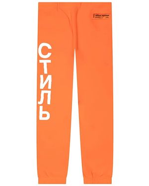 Heron Preston Pantalones de chándal con logo vertical - Naranja